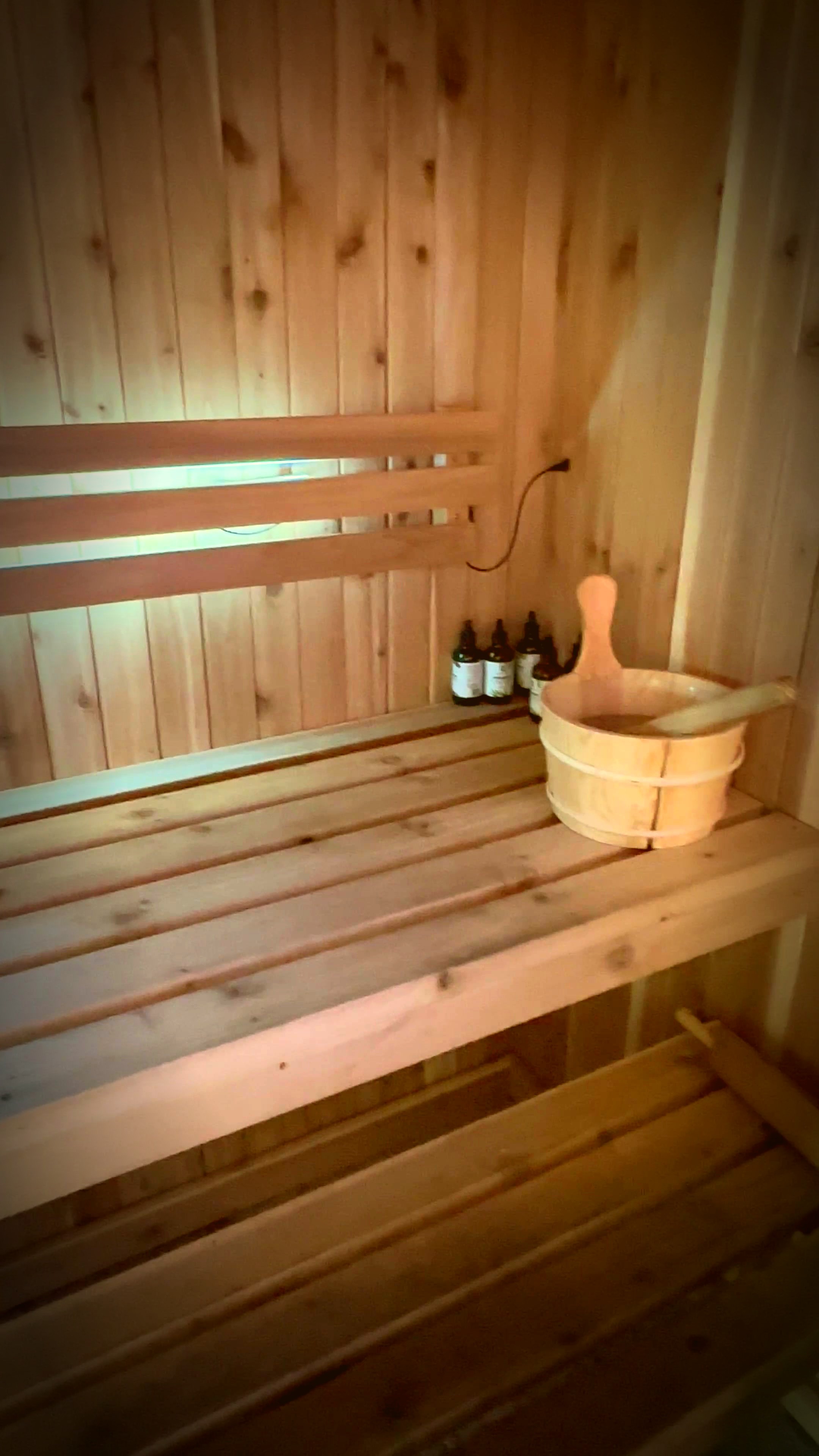 Traditional stone sauna interior with cedar benches